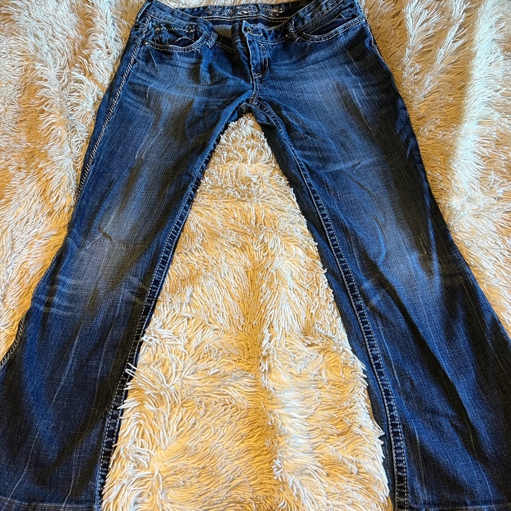 Express boot it jeans with extra detail on sides and back pockets 12 r